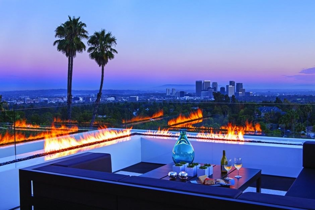 A terrace with an overlooking view of the city